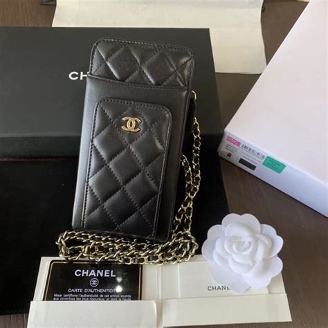 chanel fone|Chanel phone bag with chain.